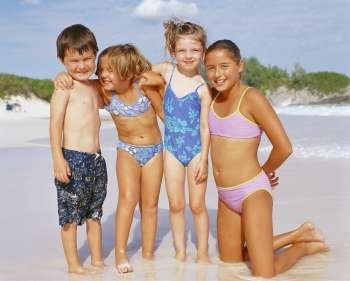 Close-up of a boy and his three sisters on the beach, Bermuda