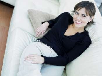 Portrait of a businesswoman reclining on a couch