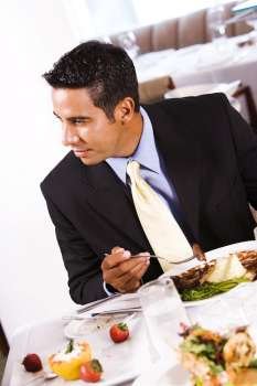 Close-up of a businessman eating