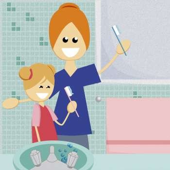 Close-up of a mother and her daughter holding toothbrushes