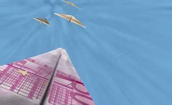 Bank notes in the shape of airplanes flying in the sky