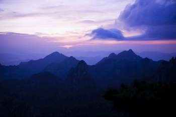 Silhouette of a mountain range at dusk, Huangshan Mountains, Anhui Province, China
