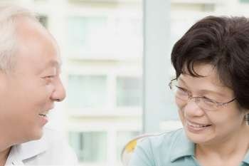 Mature couple looking at each other and smiling