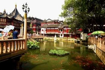 Pond in front of buildings, Yu Yuan Gardens, Shanghai, China