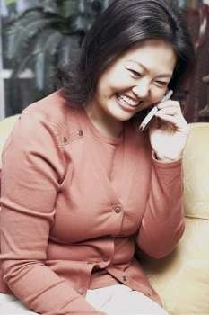 Close-up of a mature woman using a mobile phone