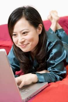 Close-up of a young woman using a laptop