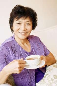 Portrait of a mature woman holding a cup of tea