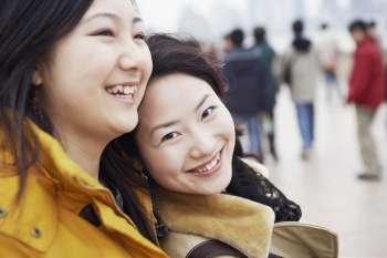 Close-up of two young women smiling