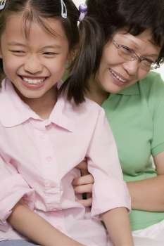 Close-up of a girl smiling with her grandmother