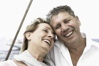 Close-up of a senior man and a mature woman smiling
