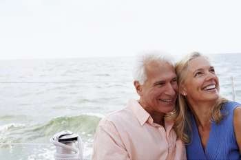 Close-up of a mature couple smiling in a boat