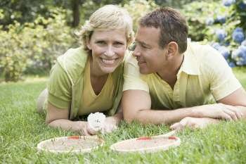 Portrait of a mature couple on grass in a lawn