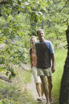 Portrait of a mature couple walking in a forest