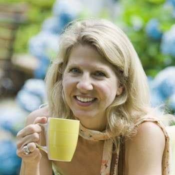 Portrait of a mature woman holding a tea cup and smiling
