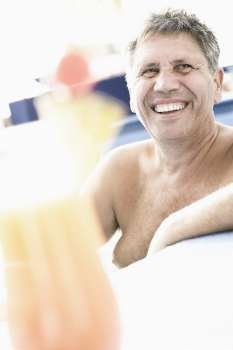 Senior man smiling in a swimming pool