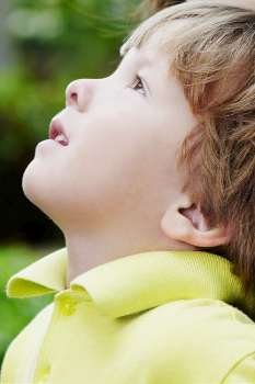 Side profile of a boy looking up