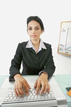 Portrait of a businesswoman using a laptop
