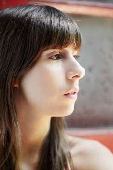 Close-up of a young woman looking away