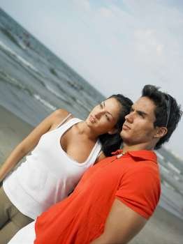 Close-up of a young couple on the beach
