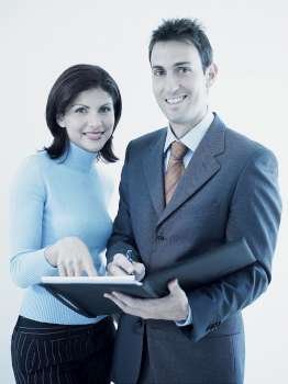 Portrait of a businesswoman and a businessman holding a personal organizer
