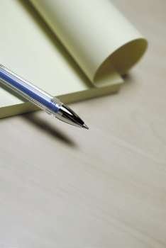 Close-up of a pen on a notepad