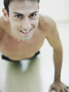 Portrait of a mid adult man exercising and smiling