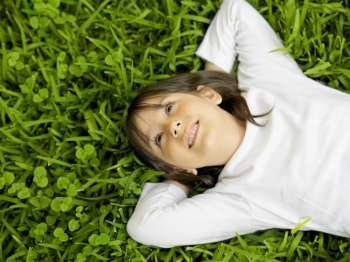 Close-up of a girl lying on the grass