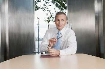 Businessman sitting in a board room
