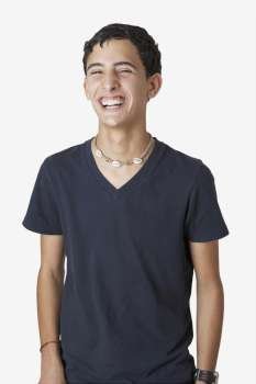Close-up of a teenage boy laughing