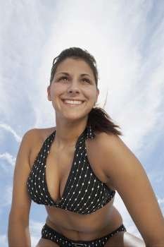 Low angle view of a young woman smiling