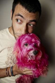 Man with hot pink dog