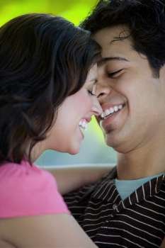 Close-up of a young couple smiling together