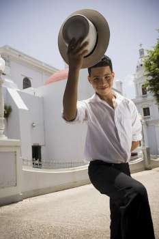 Portrait of boy wearing Plena traditional attire, outdoors