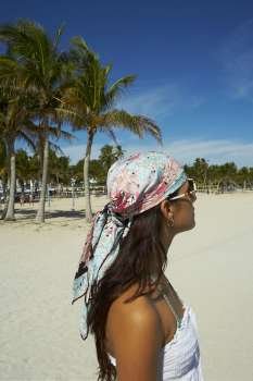 Young woman wearing bandana on beach