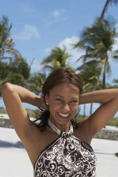 Portrait of a mature woman smiling on the beach, South Beach, Miami Beach, Florida, USA