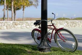 Bicycle parked against a pole, South Beach, Miami Beach, Florida, USA