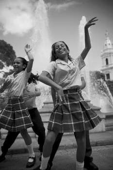 School children dancing salsa in center plaza