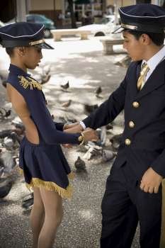 Children in park wearing pilot and flight attendant costume