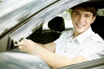 teen driver with white shirt, selective focus on nearest eye