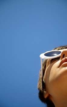 Young Woman Wearing Sunglasses, selective focus on eye