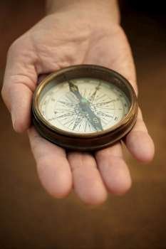 compass on the hand, selective focus,lens blur