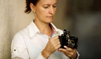 Woman with camera ,focus point on eye
