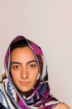 Young middle-eastern woman with head scarf.
