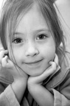 Girl (4-5) smiling, close-up, portrait