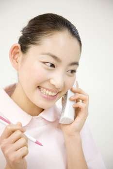 Japanese receptionist handling phone calls
