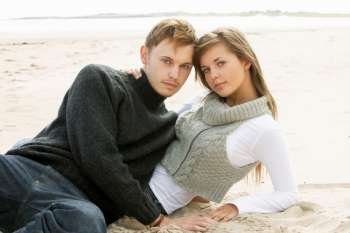 Portrait Of Young Couple On Beach