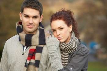 Romantic Teenage Couple In Autumn Landscape