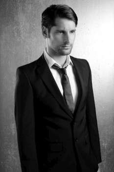 Classic elegant black and white suit handsome man portrait
