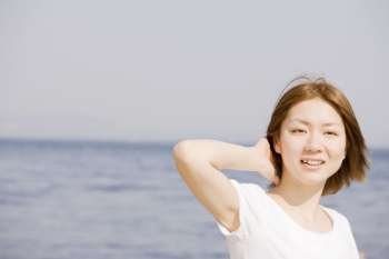 woman posing by sea