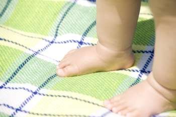 babys feet on blanket